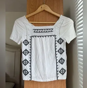 American Eagle Outfitters White Top with Black Embroidery thumbnail 1