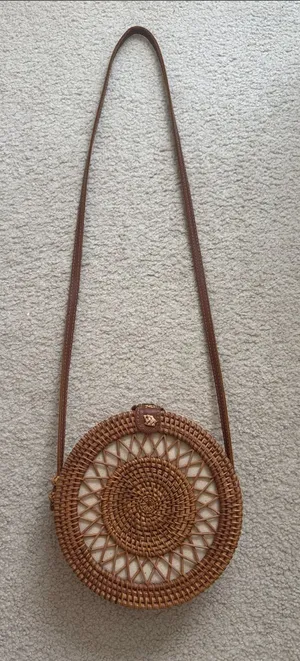 Round Woven Crossbody Bag in Brown thumbnail 1