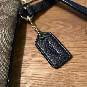 Coach Tan and Black Wristlet with Gold Accents thumbnail 2