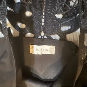 Altar’d State size Small fit and flare black mini dress with lace detail on back thumbnail 2