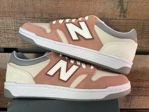 Tan and white unisex New Balance sneakers thumbnail 1
