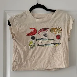 Goodie Two Sleeves Beige Crop Top with Colorful Seafood Print thumbnail 1