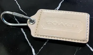 Coach Leather Key Tag in Beige and Silver Hardware thumbnail 1