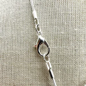 Silver tone rhinestone cross necklace thumbnail 6