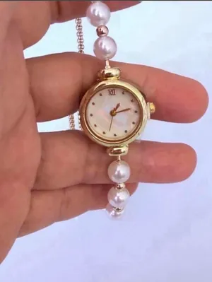 Brand New Gold pearl watch with white face and Roman numerals thumbnail 2