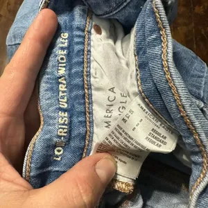 American Eagle distressed 0 low rise ultra flare raw hem jeans thumbnail 3