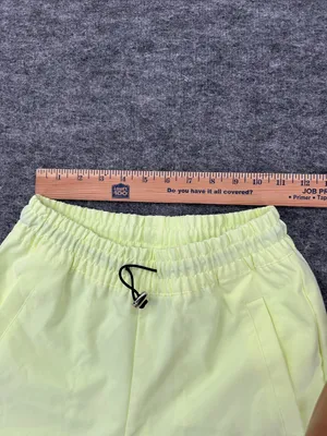 Nike Women's Sportswear Woven Pants in a bright neon green/yellow XS thumbnail 13