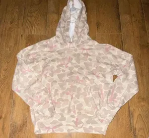 abercrombie kids A&F Essentials Pink Camo Hoodie Size 13/14 Abercrombie Kids A&F Essentials hoodie in a pink and tan camo print. Size 13/14. Pullover style with kangaroo pocket, long sleeves, ribbed cuffs and hem. Gently used with minor wear, no holes, stains, or damage. thumbnail 1