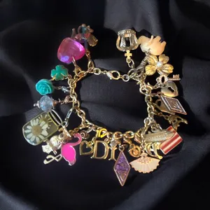 Gold tone loaded charm bracelet thumbnail 1