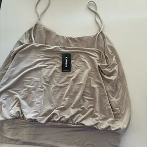 Express Tan and cream cami top #camitop #y2kstyle #model #nyc 2000s, chic, tank top, spaghetti strap, clean girl, neutrals thumbnail 3