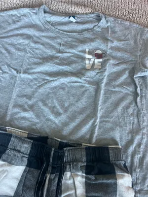 Old Navy Cozy set featuring a gray short sleeve tee with a small "LOVE" graphic. Includes black and white plaid drawstring lounge shorts. Soft, casual pieces perfect for lounging or sleepwear. thumbnail 4