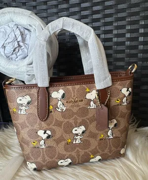 Coach X Peanuts City Mini Tote Bag In Signature Canvas With Snoopy Print thumbnail 1