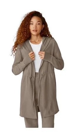 Beyond Yoga-On the go-Cozy Taupe Jacket-size large The first three stock photos are the actual color of the jacket, I had a hard time capturing the exact color in my pictures. Soft and warm taupe jacket. Ideal for comfort and style Open front Cinched waist Hooded Side pockets 67% cotton and 33% polyester Excellent condition thumbnail 1