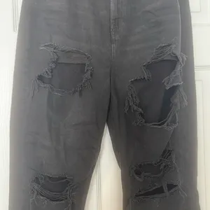 American Eagle black ripped mom jean thumbnail 2