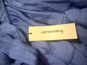 Blue dress from Francesca with tags still on it and an open back thumbnail 3