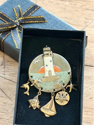 Lighthouse-Themed Enamel Brooch With Nautical Charms & Gold Accents Measures App thumbnail 1