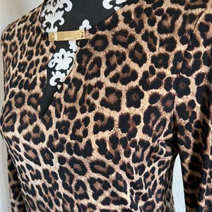 Michael Kors stretchy leopard pullover top w gold logo clasp NWOT thumbnail 4