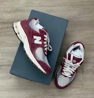 New Balance Women's 2002R Sneaker In Burgundy Size 6.5 thumbnail 1