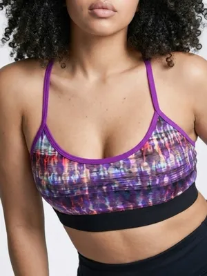 Alo Yoga racerback Spark sports bra featuring a purple abstract print thumbnail 1