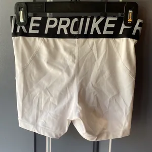Women’s white nike pros thumbnail 2
