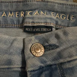American Eagle Next Level Curvy Super High Rise Flare Jean 14 X-Short Blue thumbnail 4