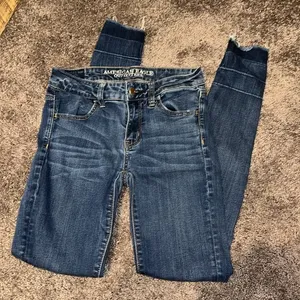 American Eagle distressed jegging raw hem fold up bottom jeans thumbnail 1