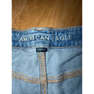 American Eagle Stretch Denim Shorts Medium Wash Raw Hem Size 16 thumbnail 2