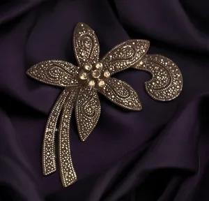 Gold tone fancy flower marcasite brooch thumbnail 1