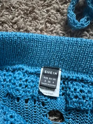 SheIn Lightweight open-knit crop top with tie-front detail. Matching crochet mini skirt with scalloped hem. Vibrant turquoise color perfect for layering or beachwear. thumbnail 2