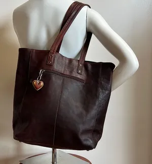 Antonio Valeria is a former Spacious Brown Leather Tote with Minimalist Design thumbnail 1