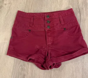 Mossimo Supply Co. Women’s High-Waisted Red Shorts – Like New, Size 00 Upgrade your summer wardrobe with these stylish Mossimo Supply Co. high-waisted shorts in a vibrant red/burgundy shade. Condition: Like new, excellent condition with no marks, stains, or flaws. Brand: Mossimo Supply Co. Size: Women's 00 / 24 Details: High-waisted silhouette, trendy multi-button closure, cuffed hems, 5-pocket styling, and durable belt loops. Material: 60% Cotton, 38% Polyester, 2% Spandex for a soft, comfortable fit with just the right amount of stretch. Fast shipping! Feel free to reach out with any questions. thumbnail 1