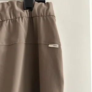 NWOT Vuori Cropped High-Rise Straight Pants in Taupe thumbnail 8