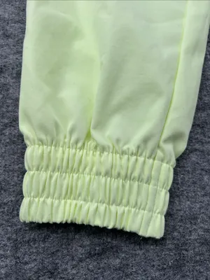Nike Women's Sportswear Woven Pants in a bright neon green/yellow XS thumbnail 7