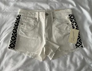 White High-Rise Raw Hem Shorts With Black Tribal Detail thumbnail 1