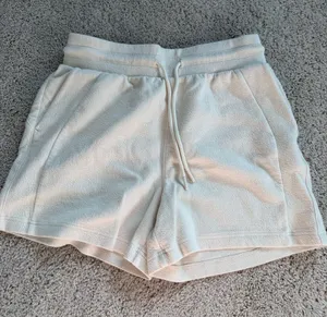 Danskin cream shorts with subtle textured weave, size S thumbnail 1