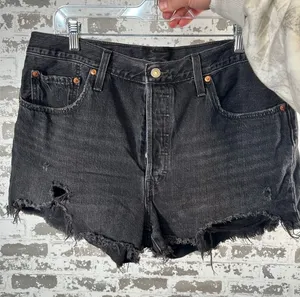 Levi’s | women black button fly denim shorts distressed thumbnail 1