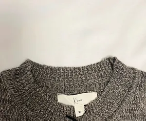 Heather gray marled fringe hem knit dress from the boutique brand Klesis thumbnail 6
