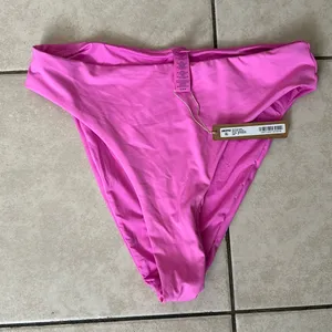 Skims signature swim mid waist bottom Neon Orchid NWT‎ size M thumbnail 1