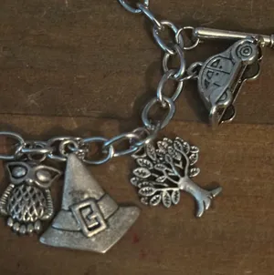 Silver tone charm bracelet with assorted charms thumbnail 4