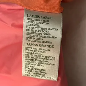 a Tangerine women's puffer vest in pink with orange side panels. Size large thumbnail 6
