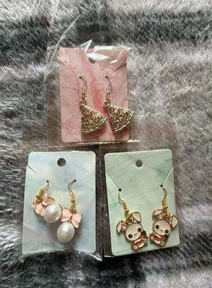 Variety Pack of Three Pairs of Dangle Earrings Featuring Pizza, Pearl and Bow, a thumbnail 1