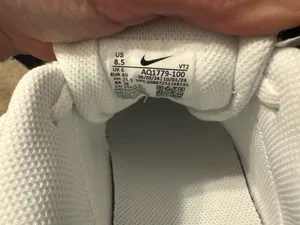 All white unisex Nike sneakers thumbnail 5