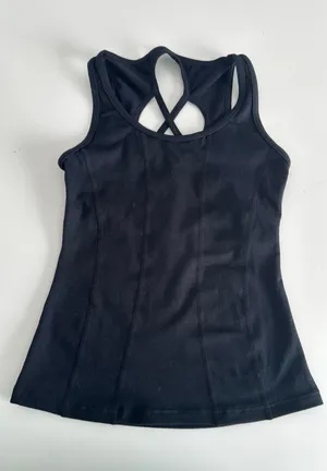 Capezio black tank top with cut out design on back. Size large child thumbnail 1