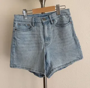 Calvin Klein Light wash high-waisted denim shorts thumbnail 1