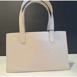 Ted Baker Icon small tote bag in a cream-colored, structured material. thumbnail 1