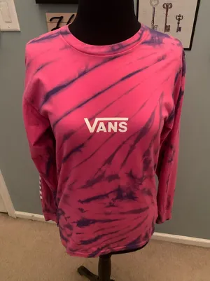 This is a pink and purple Vans tie-dye long-sleeve t-shirt featuring the brand's signature white logo on the chest. thumbnail 1