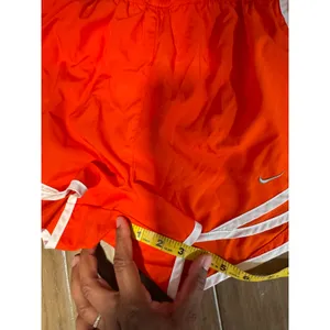 Nike Dri-FIT Tempo Running Shorts Women’s‎ Small Orange White Trim Athletic thumbnail 5
