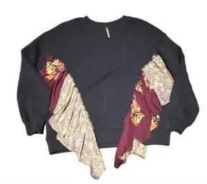 Free People She's Just Cute pullover sweatshirt in Washed Black. Size XS. Crew neck with floral fabric ruffle detail. Pre-owned with on spot of peeling shown in last photo thumbnail 1