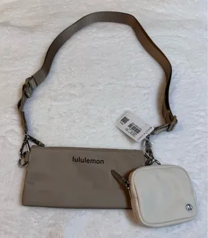 Dual pouch sling bag in beige by Lululemon thumbnail 1