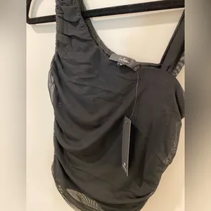 NWT Lulu’s-Beautiful Vision Black Mesh Asymmetrical Top-Size Medium thumbnail 3